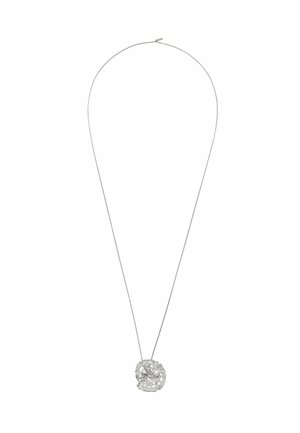 Delicate silver chain necklace with an abstract, textured circular pendant featuring intricate cut-out details.