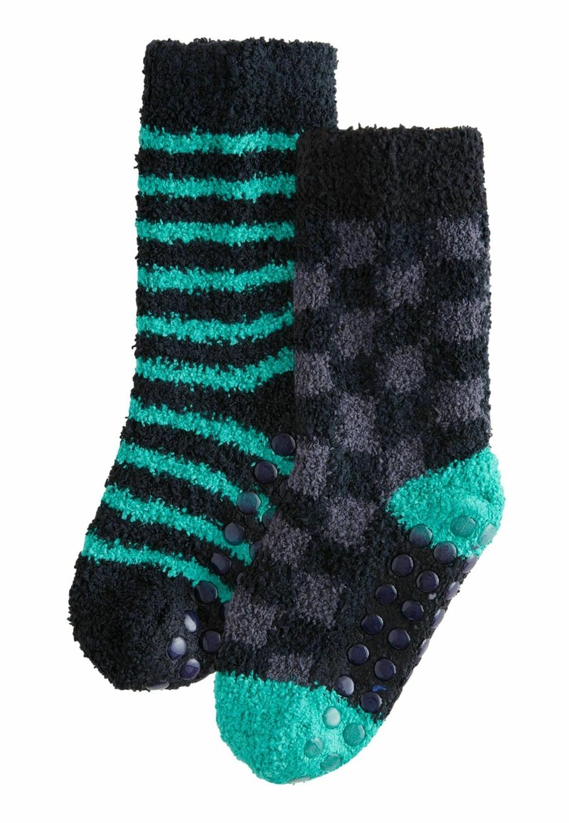 Calzini di pile con righe teal e nere in uno e design a scacchi nero e grigio nell'altro, entrambi con punti di presa in gomma testurizzati.
