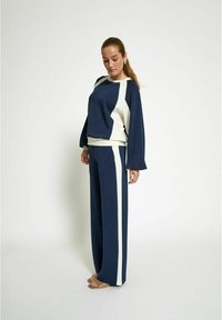 PEPPERCORN Tracksuit bottoms - black iris