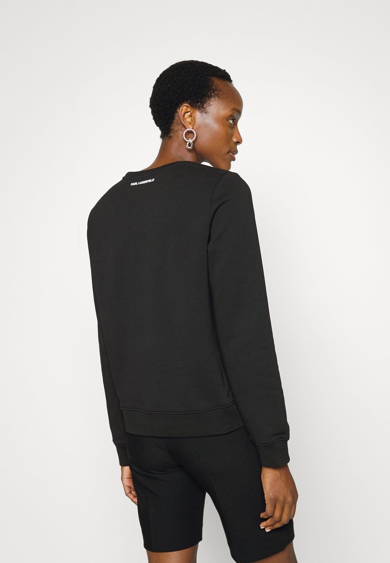 Damen Sweatshirts | KARL LAGERFELD ELONGATED LOGO ZEBRA Sweatshirt black/schwarz - KF66083 Damen Sweatshirts | KARL LAGERFELD ELONGATED LOGO ZEBRA Sweatshirt black/schwarz - KF66083