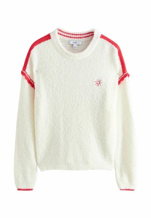 Biały miękki sweter z długimi rękawami, czerwonymi paskami na ramionach i mankietach oraz małym czerwonym emblematem śnieżynki na piersi.