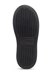 Sole di scarpa in gomma nera con motivo di battistrada ondulato e nome del marchio "Natrino" impresso vicino all'arco, taglia contrassegnata come 26.