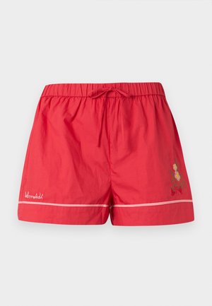 Red elastic waist shorts with drawstring, white piping near hem, small floral embroidery on right leg, and white brand text on left leg.