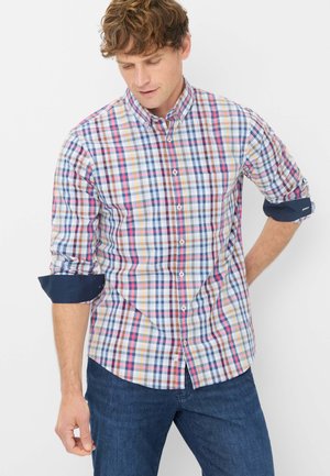 Chemise à carreaux avec un mélange de carrés bleus, roses et jaunes. Manches longues retroussées avec des accents en marine. Tissu en coton.