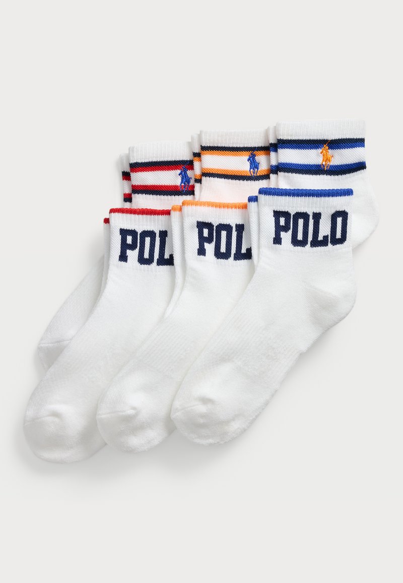 Négy pár fehér zokni, kontrasztos bordázott mandzsettával piros, narancs és kék színben. Mindegyiken "POLO" és egy kis logó van hímzve az oldalán.