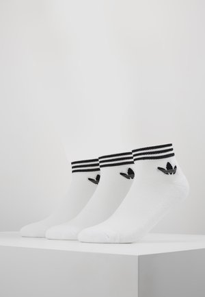 White ankle socks featuring black stripes at the cuff and a small black logo. Smooth texture, set of three pairs.