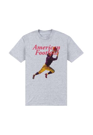 Grå t-shirt med teksten "American Football" og illustration af en fodboldspiller i lilla og gul uniform, der springer for at gribe en bold.