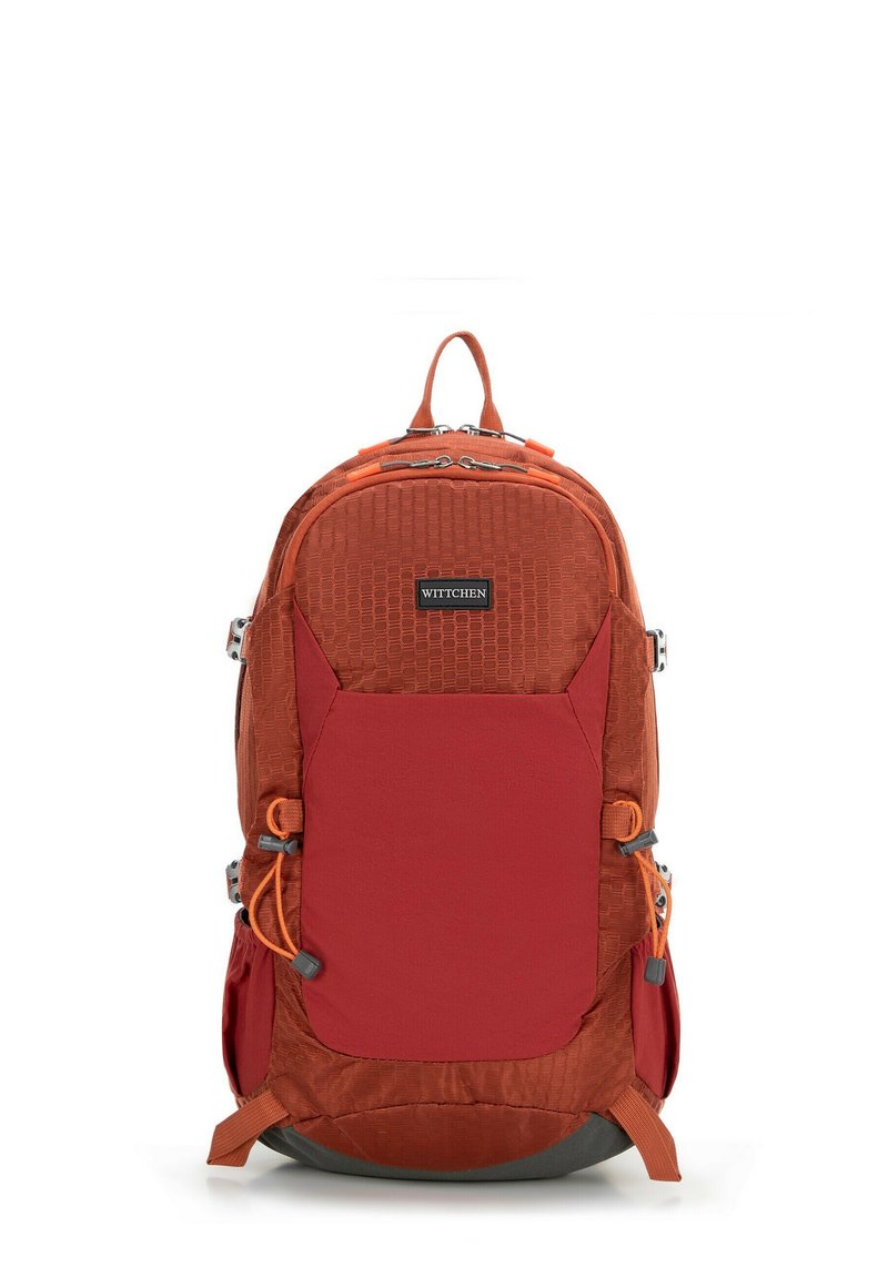 Red and orange backpack with a textured surface, zippered compartments, adjustable straps, and a front pocket. Material is durable fabric.