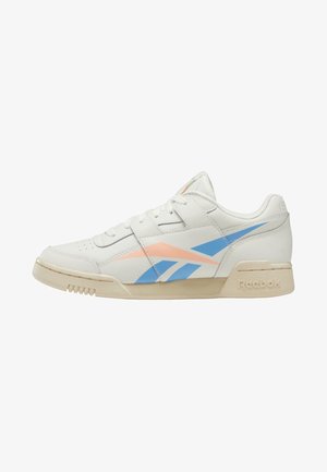 White leather sneakers with light blue and coral accents. Features a low-top design, rubber sole, reinforced toe, and Reebok logo.