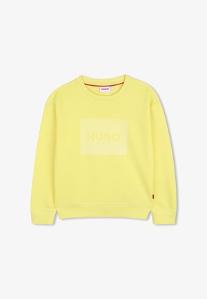 Gele sweatshirt met een geribbelde textuur, ronde halslijn en een voorpaneel met een reliëf "HUGO" logo. Gebreide manchetten en zoom.
