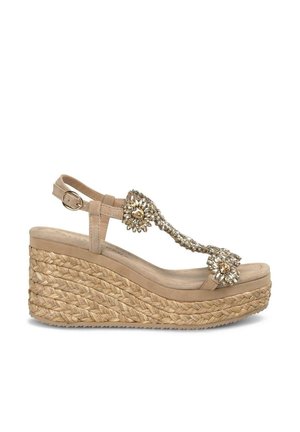 Beige Keilsandale mit einer aus Jute gewebten Plattform, verziert mit zwei dekorativen Blumenapplikationen am Riemen über dem Vorfuß. Verstellbare Knöchel-Schnalle.