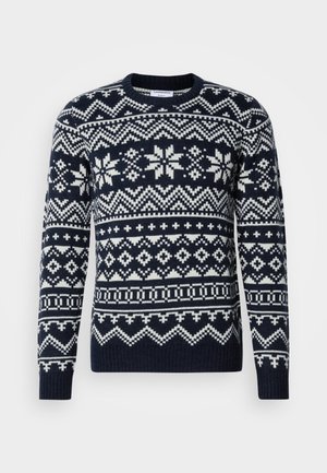 Navy blue knitted sweater featuring a white geometric and snowflake pattern, ribbed cuffs and hem, crew neck design.