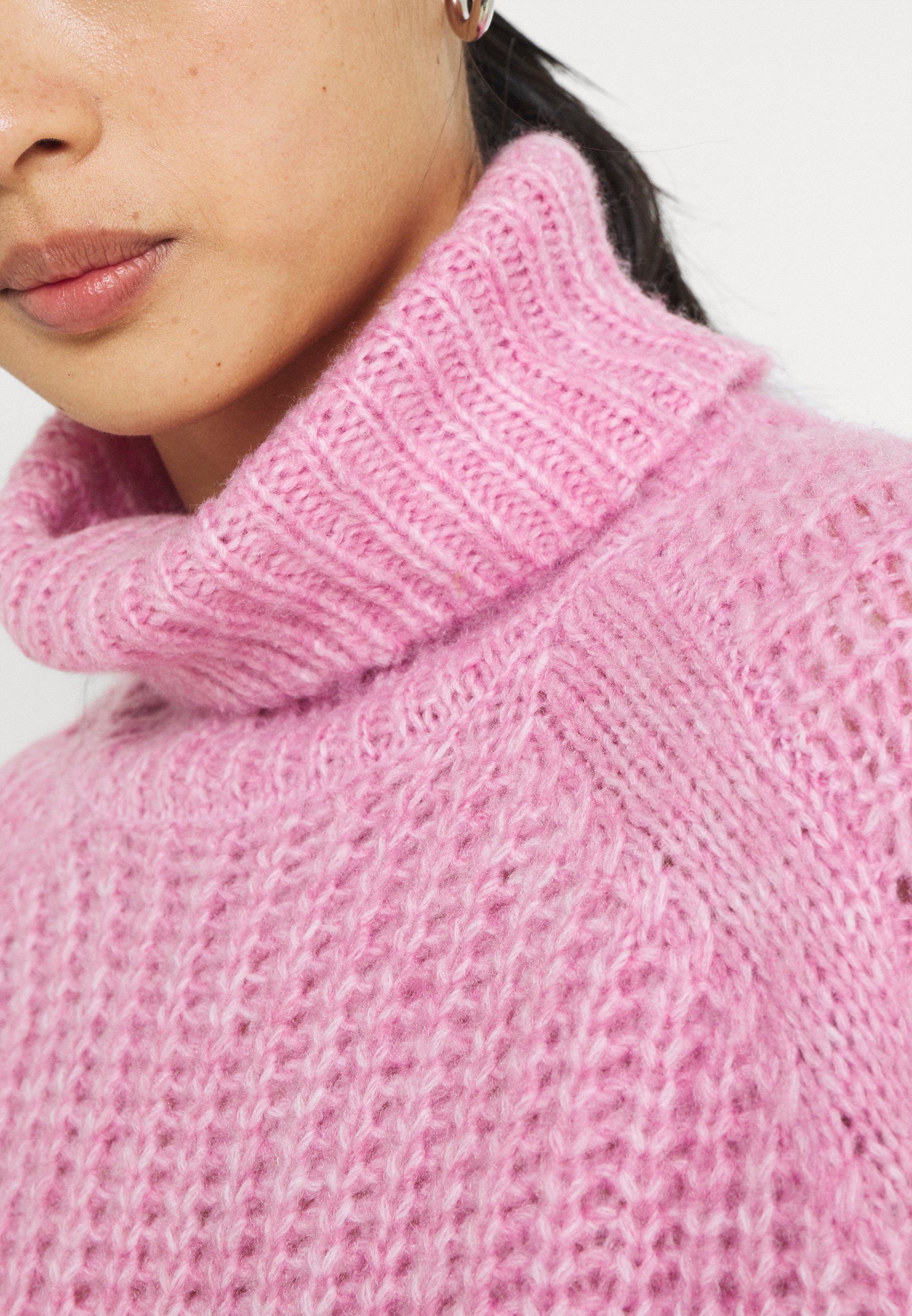 pink turtleneck jumper