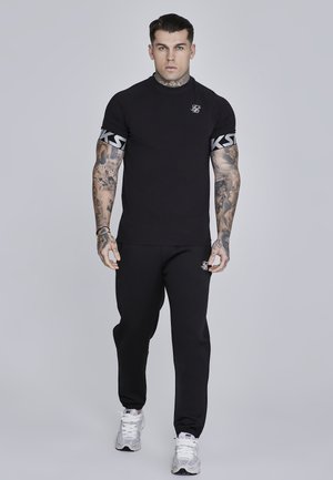 ESSENTIALS JOGGERS - Tepláky - black