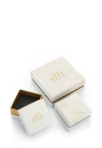 Tre smykkeræder med hvid yderside, guldtryk, en med sort indre, der viser forskellige former og størrelser. Materialet er genanvendeligt.