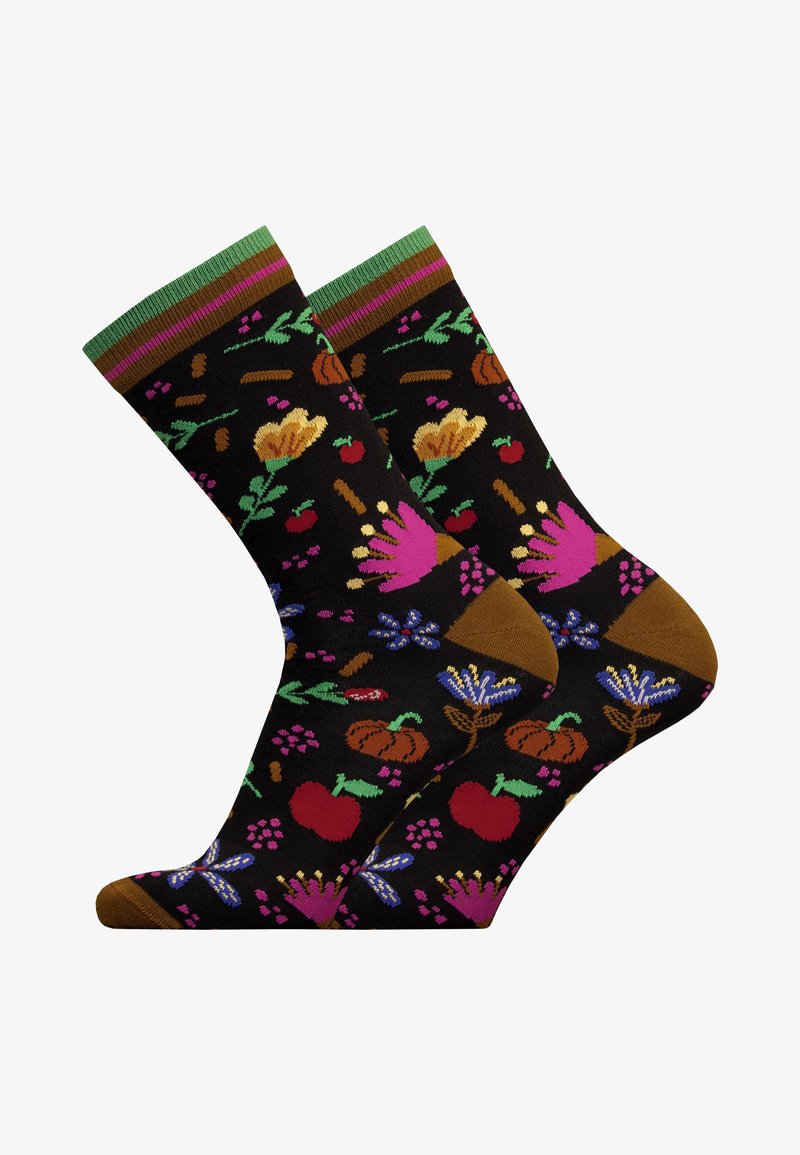 Schwarze Socken mit bunten floralen und fruchtigen Mustern; Oberteil mit grünen und lila Streifen; braune Zehen- und Fersenakzente; gestrickter Stoff.