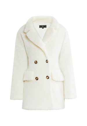 Witte nep bont dubbelzijdige jas met een gekartelde kraag, voorzakken en een gestructureerde afwerking. Voorzien van ronde bruine knopen.
