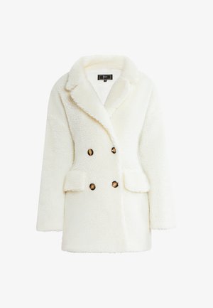 Witte nep bont dubbelzijdige jas met een gekartelde kraag, voorzakken en een gestructureerde afwerking. Voorzien van ronde bruine knopen.