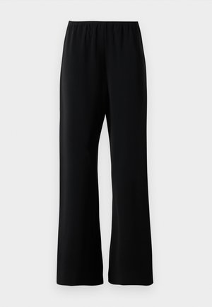 Calças largas pretas com cintura elástica, tecido suave e um corte descontraído, expostas contra um fundo branco.