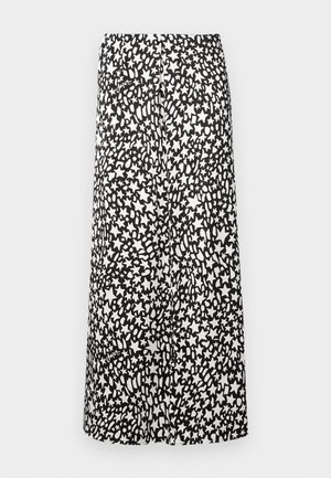 Black and white midi skirt featuring an abstract star pattern, with a smooth texture and elastic waistband for a comfortable fit.