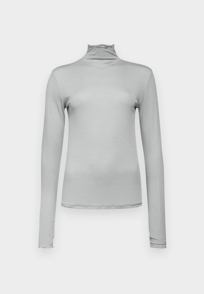 Hele hallid pikkade varrukatega turtleneck, mis on valmistatud siledast ja venivast kangast. Kitsas lõige kõrge kaelusega ja peene ruffle äärega.