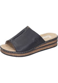 Sandale glissante en cuir noir avec un bout ouvert, un intercalaire en liège et une semelle intérieure beige. Présente des détails cousus et un petit logo sur le côté.