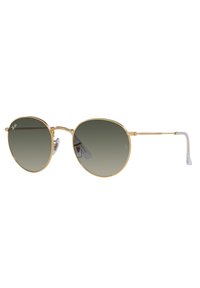 Occhiali da sole in metallo dorato con grandi lenti rotonde e gradazione di grigio. Presentano cuscinetti nasali trasparenti e tempie sottili. Design minimalista.