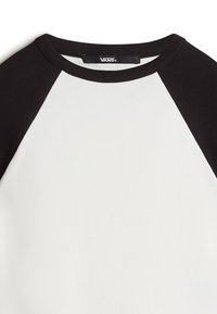 White and black long-sleeve baseball-style t-shirt with a round neck, featuring black raglan sleeves and a solid white body. Brand label visible.