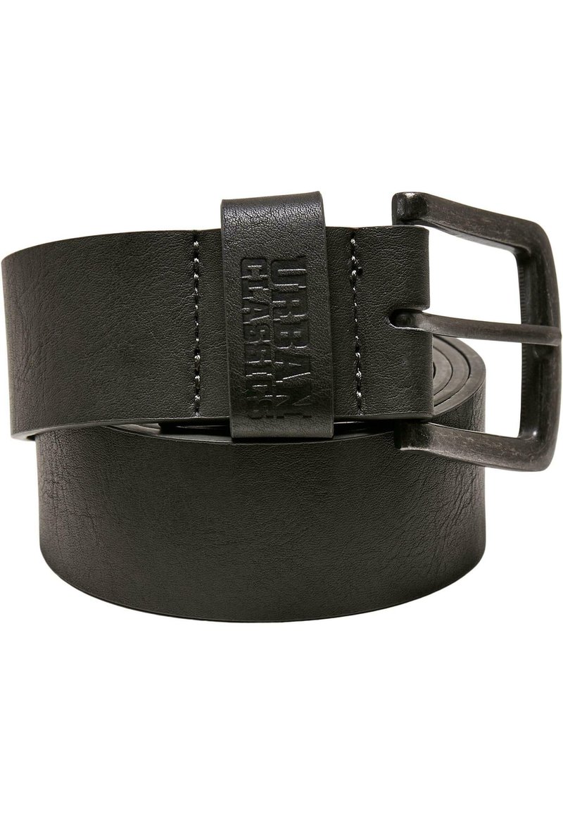 Black leather belt featuring a metal buckle, branded with "Urban Classics." Smooth texture with subtle stitching details. Circular end shape.