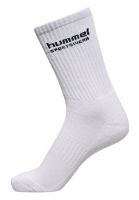 Hvid ankelstrømpe lavet af ribbet bomuld. Har et sort "hummel" logo på siden, medium tykkelse og forstærkede hæl- og tofområder.