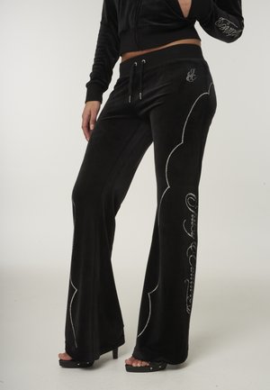 WESTERN - Tracksuit bottoms - black