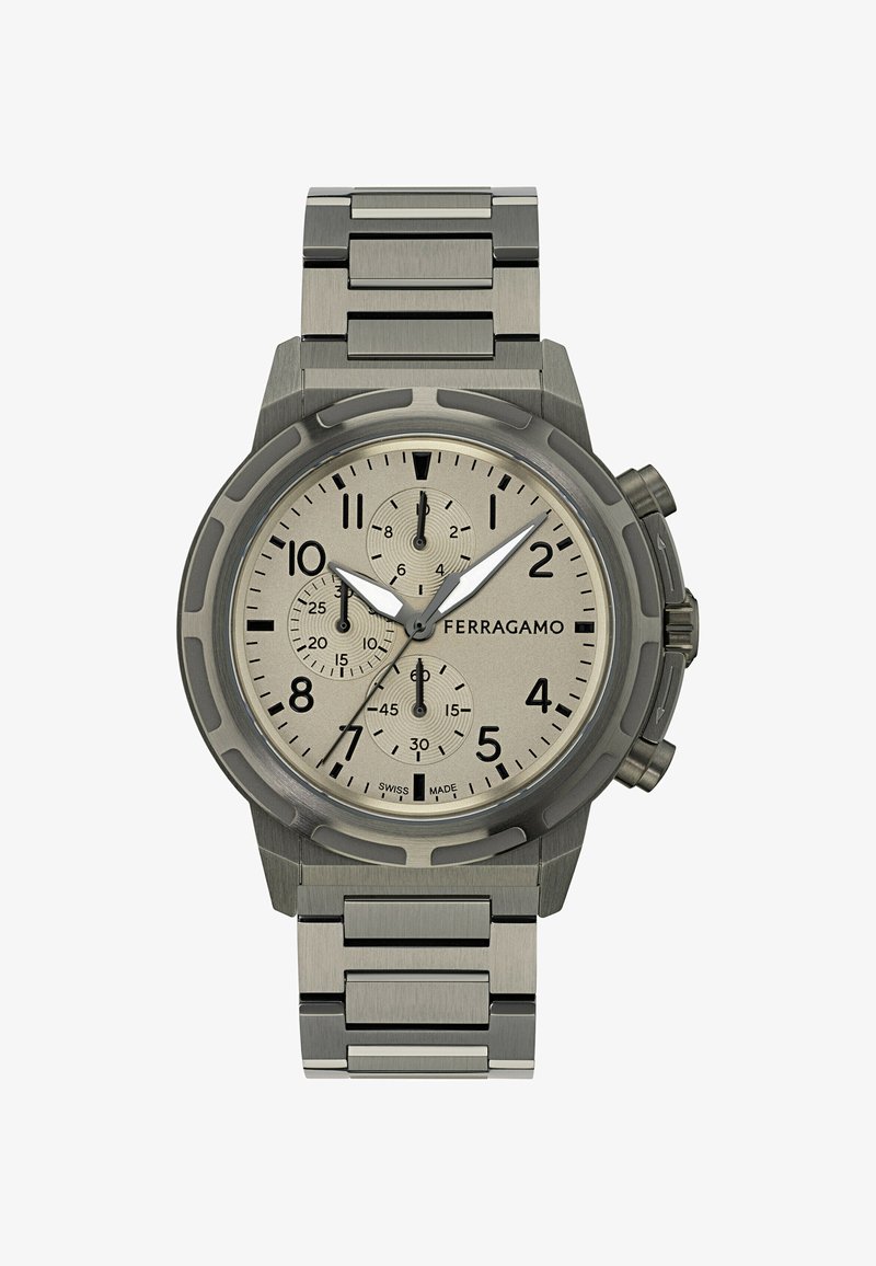 Tēra hronogrāfa pulkstenis ar apaļu gaiši pelēku ciparnīcu, melniem arābu cipariem un pulētu metāla aproci ar taisnstūra posmiem.