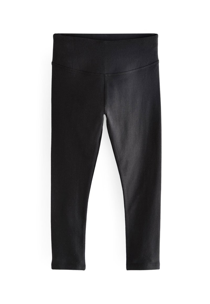 Zwarte leggings van een gladde, elastische stof. Voorzien van een brede tailleband en een aansluitend ontwerp dat naar de enkel toe tapsert. Geen zichtbare patronen of accenten.