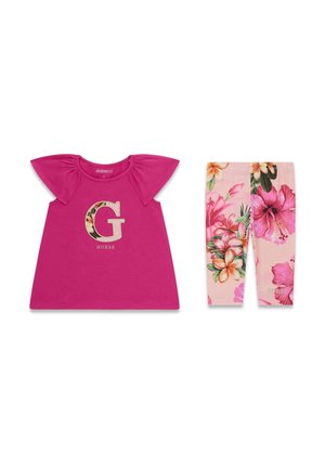 Vestito rosa per bambina con maniche a sbuffo e logo a forma di lettera G floreale abbinato a leggings rosa con motivo floreale.
