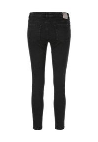 Jean noir coupe slim vu de dos avec deux poches arrière et une étiquette de marque sur la ceinture.