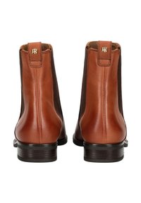 Bottines en cuir avec une combinaison de couleurs marron et beige, des panneaux latéraux élastiques et un petit talon. Présente un logo à l'arrière.