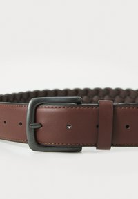 Braided brown leather belt with a black metal buckle and stitching details, featuring holes for adjustable sizing.