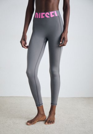 Gray leggings with a pink "DIESEL" waistband, featuring smooth texture, fitted design, and side seams for added detail.