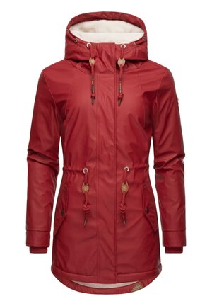 Red waterproof jacket with a fleece-lined hood, adjustable drawstrings, side pockets, and a longer hem for extra coverage.