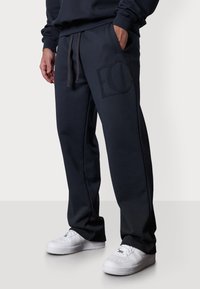 EC APPLIQUÉ LOOSE - Pantalon de survêtement - woodland