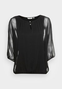 Czarna bluzka z lekkimi, przezroczystymi długimi rękawami, okrągłym dekoltem, otworem w kształcie łezki oraz trzema dekoracyjnymi guzikami z przodu.
