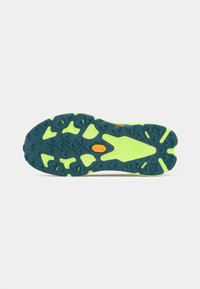 Dark blue and neon green running shoe sole with heart-shaped tread patterns and an orange Vibram logo in the center.