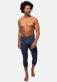 Herren Navy-Thermo-Leggings aus Rippstoff, mit figurnaher Passform und elastischem Bund, in knöchelhafter Länge.