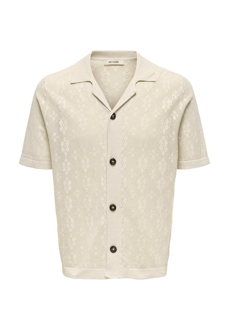 Camicia a maniche corte, con bottoni, di colore beige chiaro, caratterizzata da un motivo in maglia testurizzata, colletto a punta e cinque bottoni scuri lungo la parte anteriore.