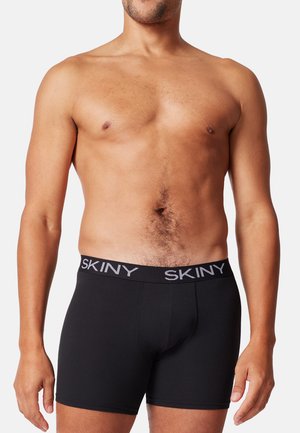 Schwarze Boxershorts mit weicher Textur, ausgestattet mit einem grauen SKINY-logo Gürtelbund, elastischer Passform und mittellanger Schnittführung.