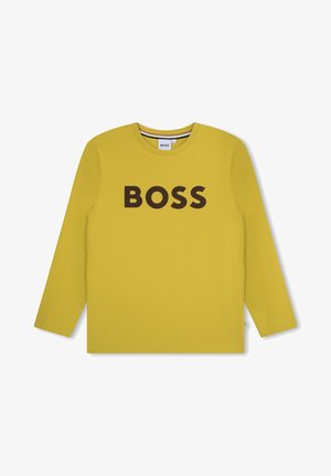 Maglietta gialla a manica lunga con collo rotondo, con la scritta nera "BOSS" in grassetto stampata al centro davanti.