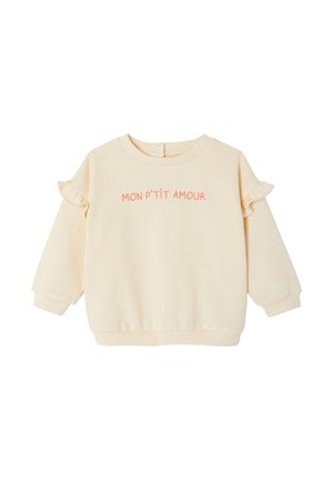 Cream-colored long-sleeve toddler sweatshirt with ruffle details on sleeves and "MON P'TIT AMOUR" embroidered in pink on the chest.