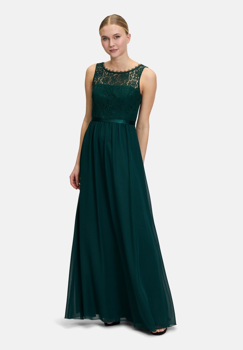 Dark green floor-length dress featuring a lace bodice, sleeveless design, and a cinched waist, with a flowing skirt made of a lightweight material.