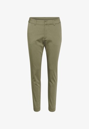 Roheline slim-fit püksid, millel on sile tekstuur, lame esiosa, aktsentkottid ja kitsenevad jalad, disainitud modernse välimuse jaoks.