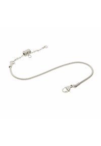 Srebrna bransoletka z elastycznym łańcuchem, z zapięciem typu lobster i dekoracyjnym okrągłym ogniwem, o gładkiej fakturze.